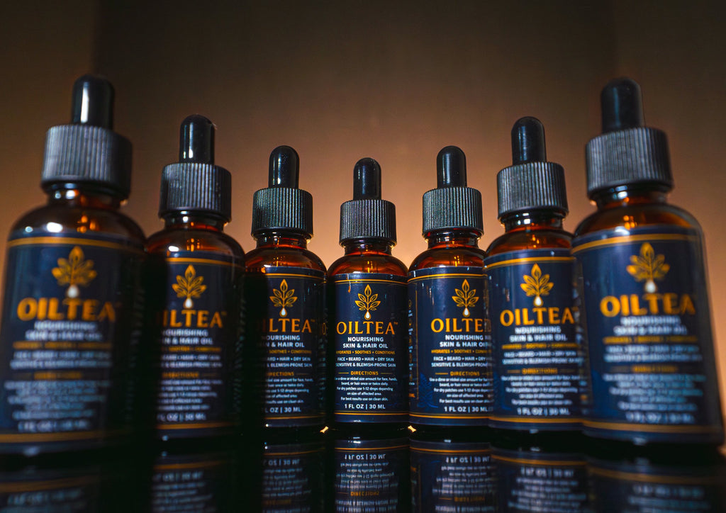 Lineup of seven OILTEA bottles side by side